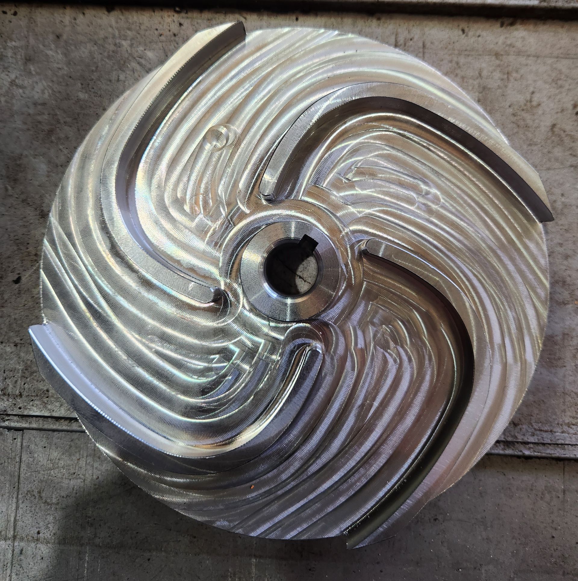 A silver circular object with a hole in the middle