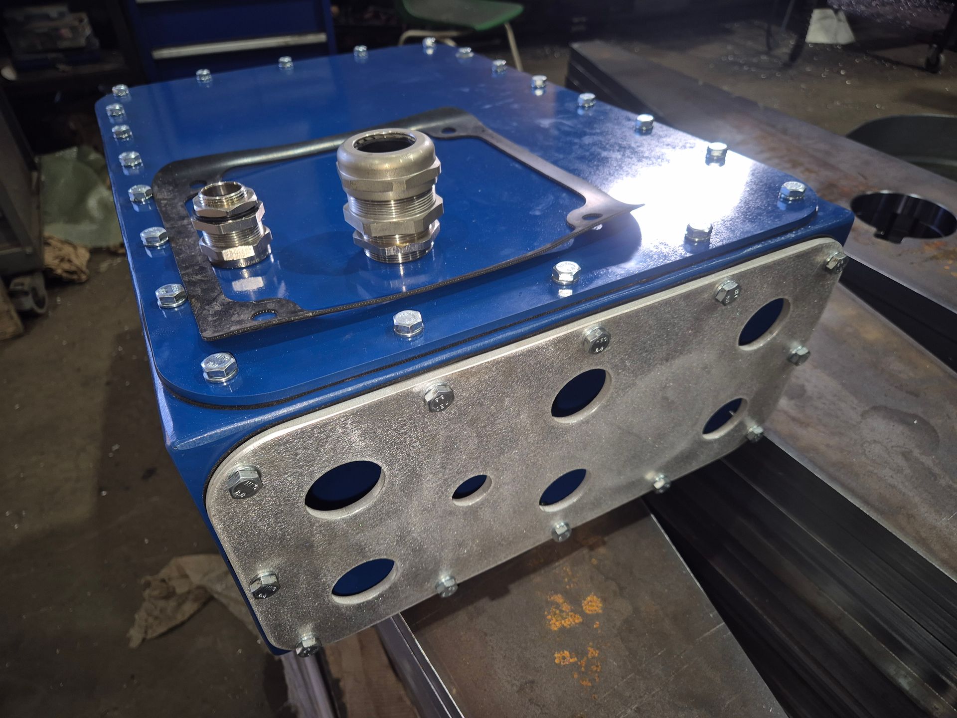 A blue box with holes in it is sitting on a table