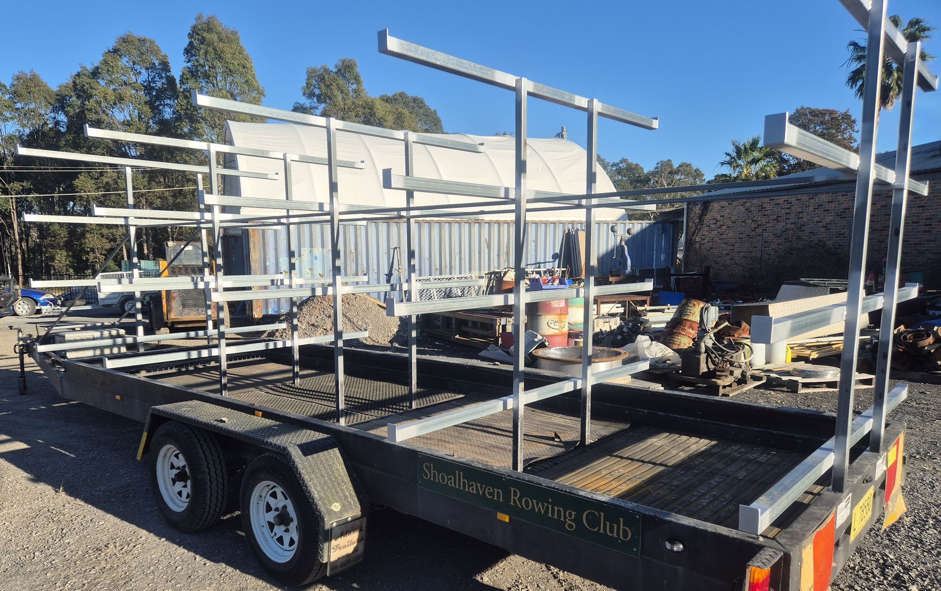 A trailer with a lot of metal bars on it