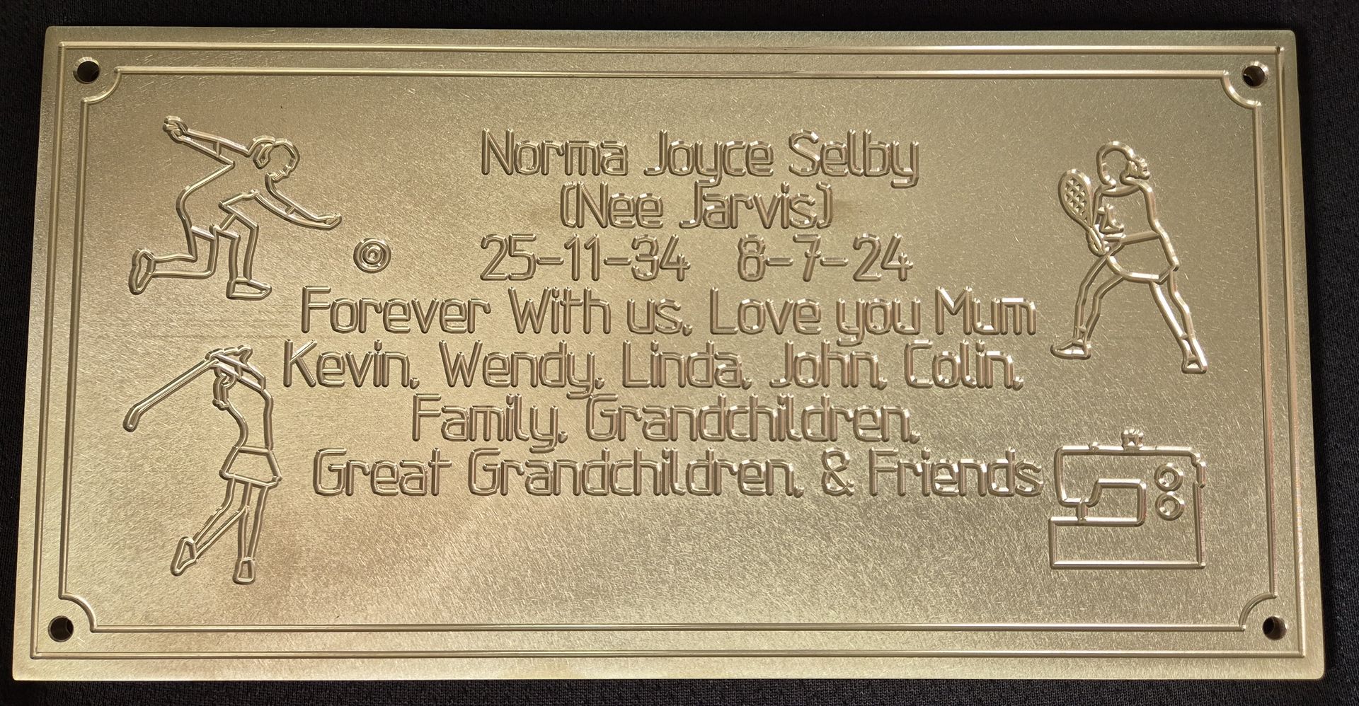 A gold plaque with the words