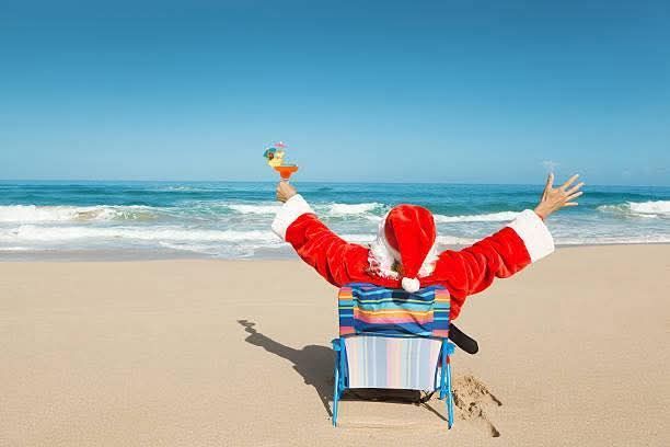 Santa is sitting on a beach in Mexico, Vacation Travel Exclusives
