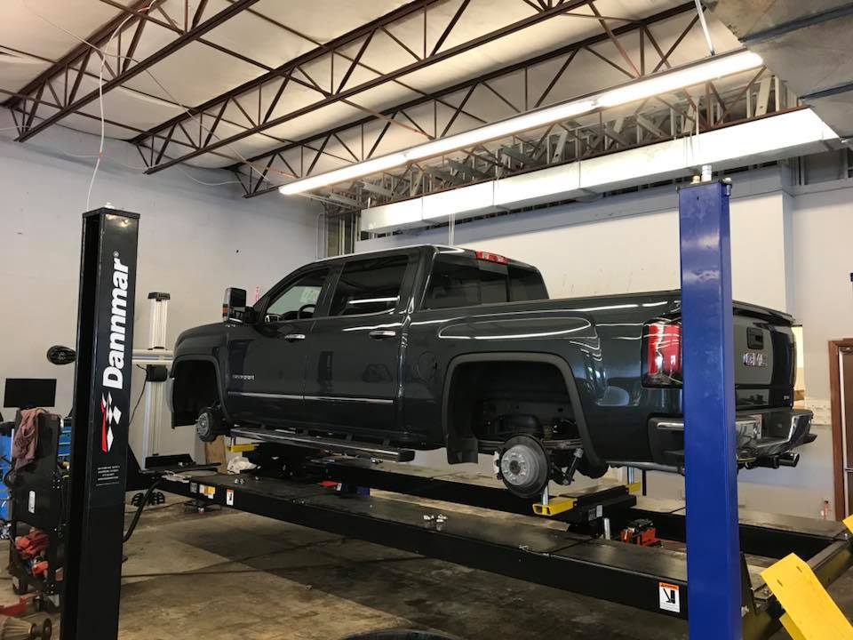 Pickup Truck On A Lift — Largo, FL — Johnny's All County Auto & Truck Repair