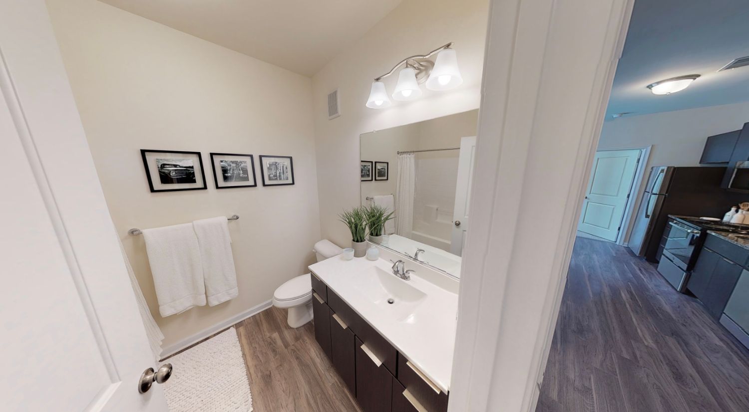 A bathroom with a sink , toilet , and mirror.