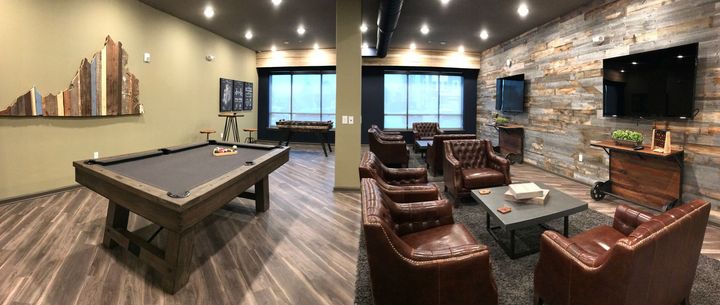 There is a pool table in the middle of the room.