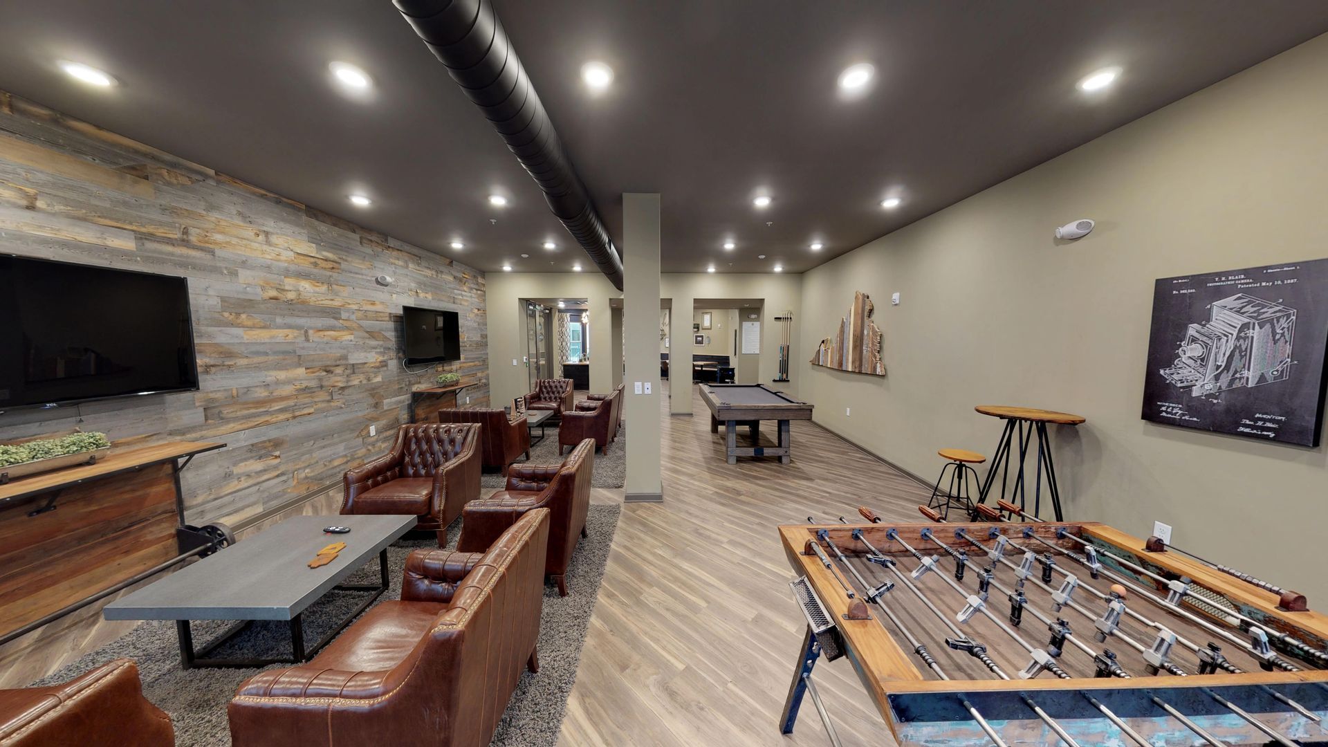 There is a foosball table in the middle of the room.