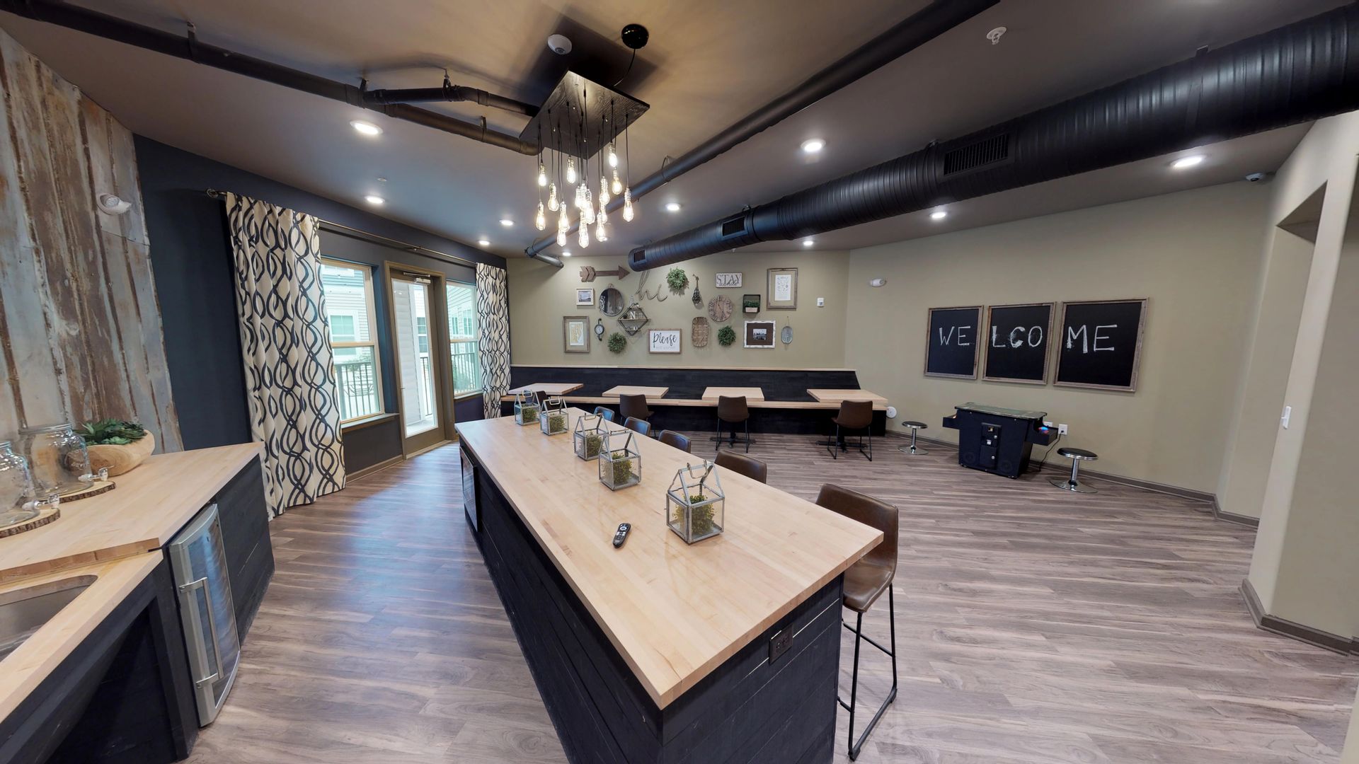 There is a long table in the middle of the room.