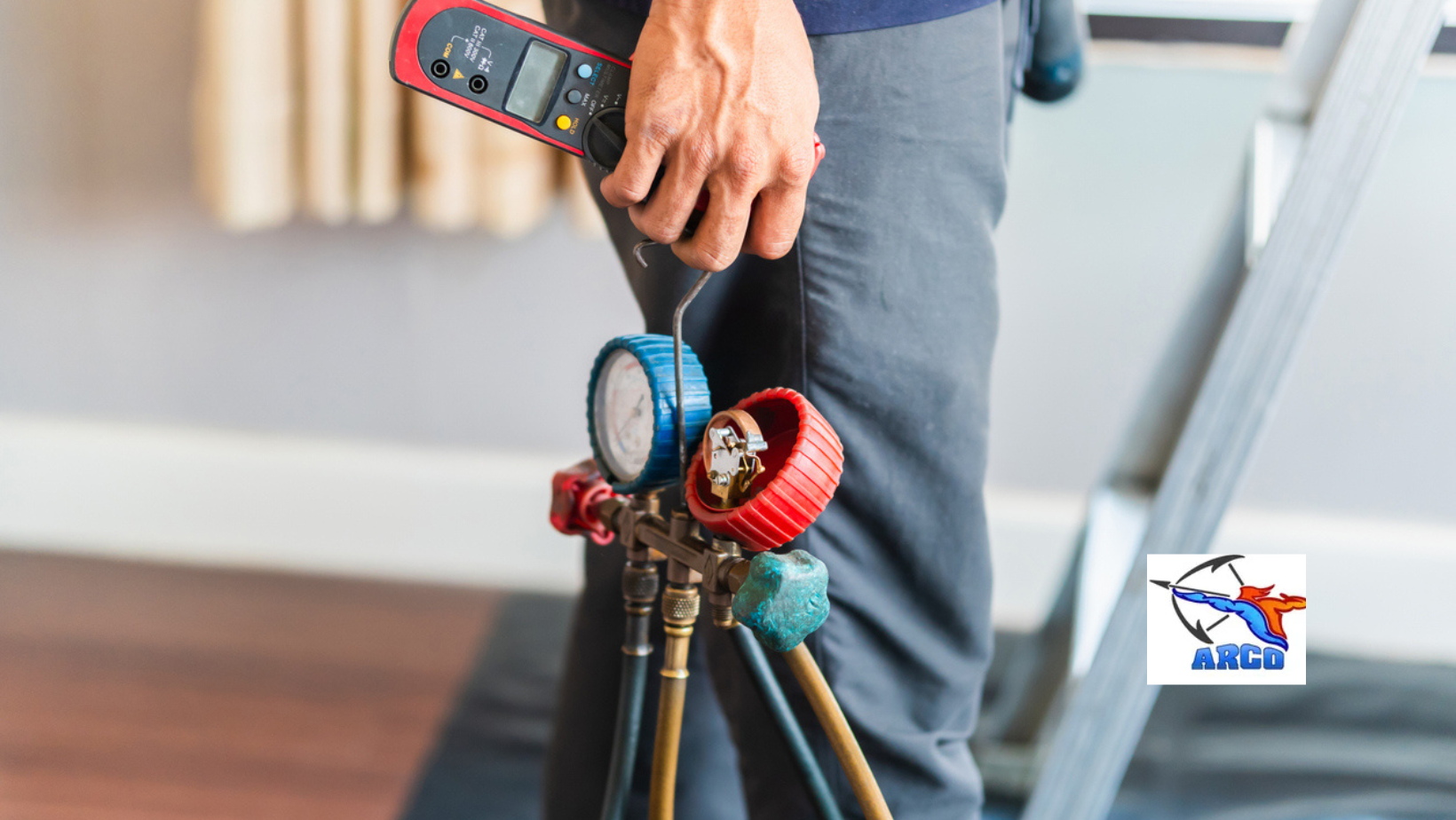 A hand adjusting a thermostat, with a zipped illustration showing sunny and snowy scenes, suggesting temperature control.