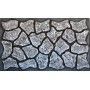 A door mat with a stone pattern on it.
