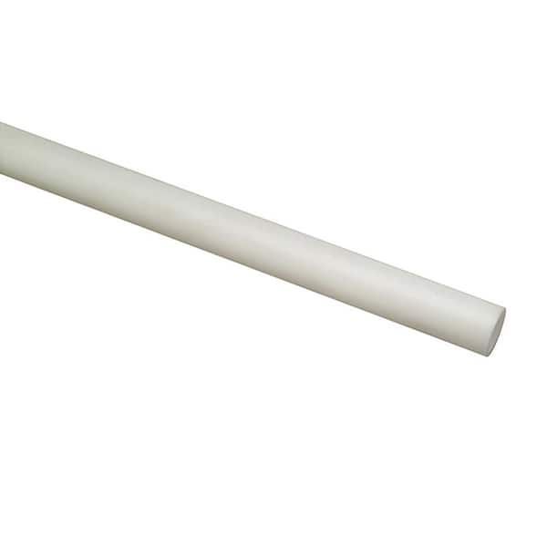 A white plastic pipe is sitting on a white surface.