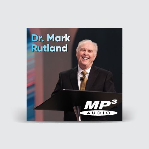 Dr. Mark Rutland at a podium, smiling. "MP3 AUDIO" logo.