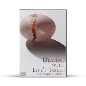 Cracked egg casts shadow on white, the title reads "Dealing with Life's Issues" by Dr. Mark Rutland.