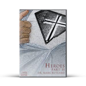 Book cover with a hand pointing to a cross-shaped emblem on a shirt. Title: "Heroes Part II." Author: Dr. Mark Rutland.