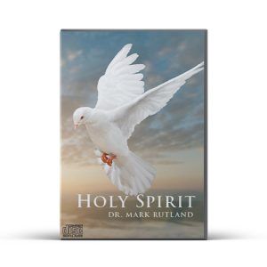 White dove in flight against a cloudy sky; title "Holy Spirit" by Dr. Mark Rutland on a disc case.