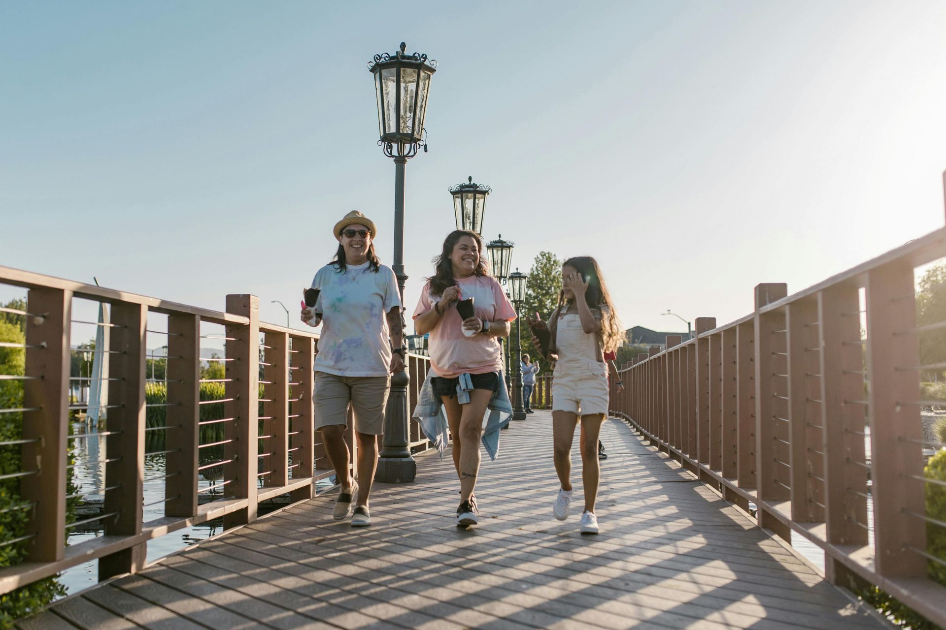 Happy family walking on a footbridge.