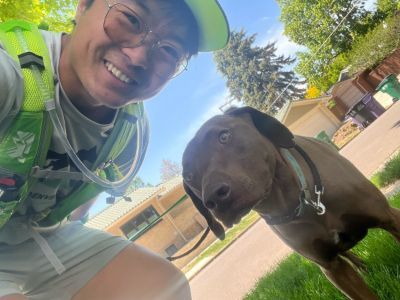 Andrew taking a selfie with a dog