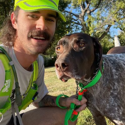 Armand taking a selfie with a dog