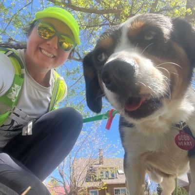 Christina taking a selfie with a dog
