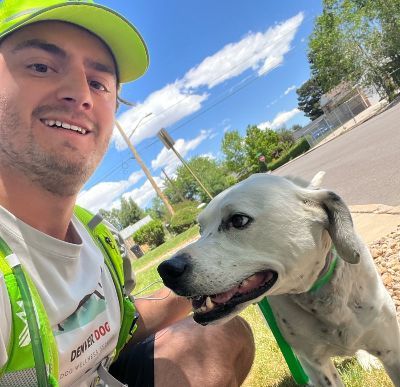 Cory taking a selfie with a dog