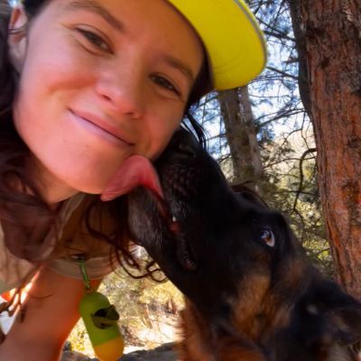 Emma taking a selfie with a  dog