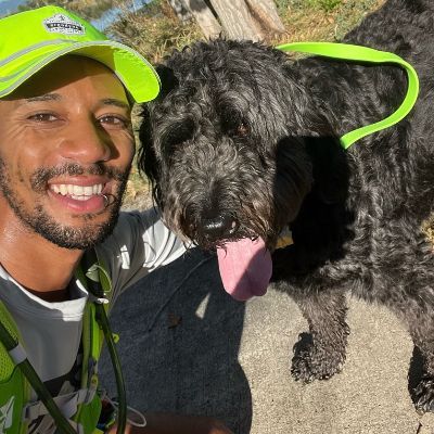 Jonathon taking a selfie with a dog.