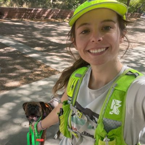 Lainey taking a selfie with a dog.
