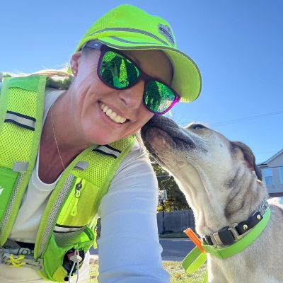 Laura Jane getting a kiss from a dog client