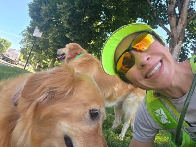 Roberta taking a selfie with a golden retriever.