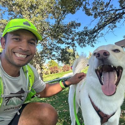 Seth taking a selfie with a dog.