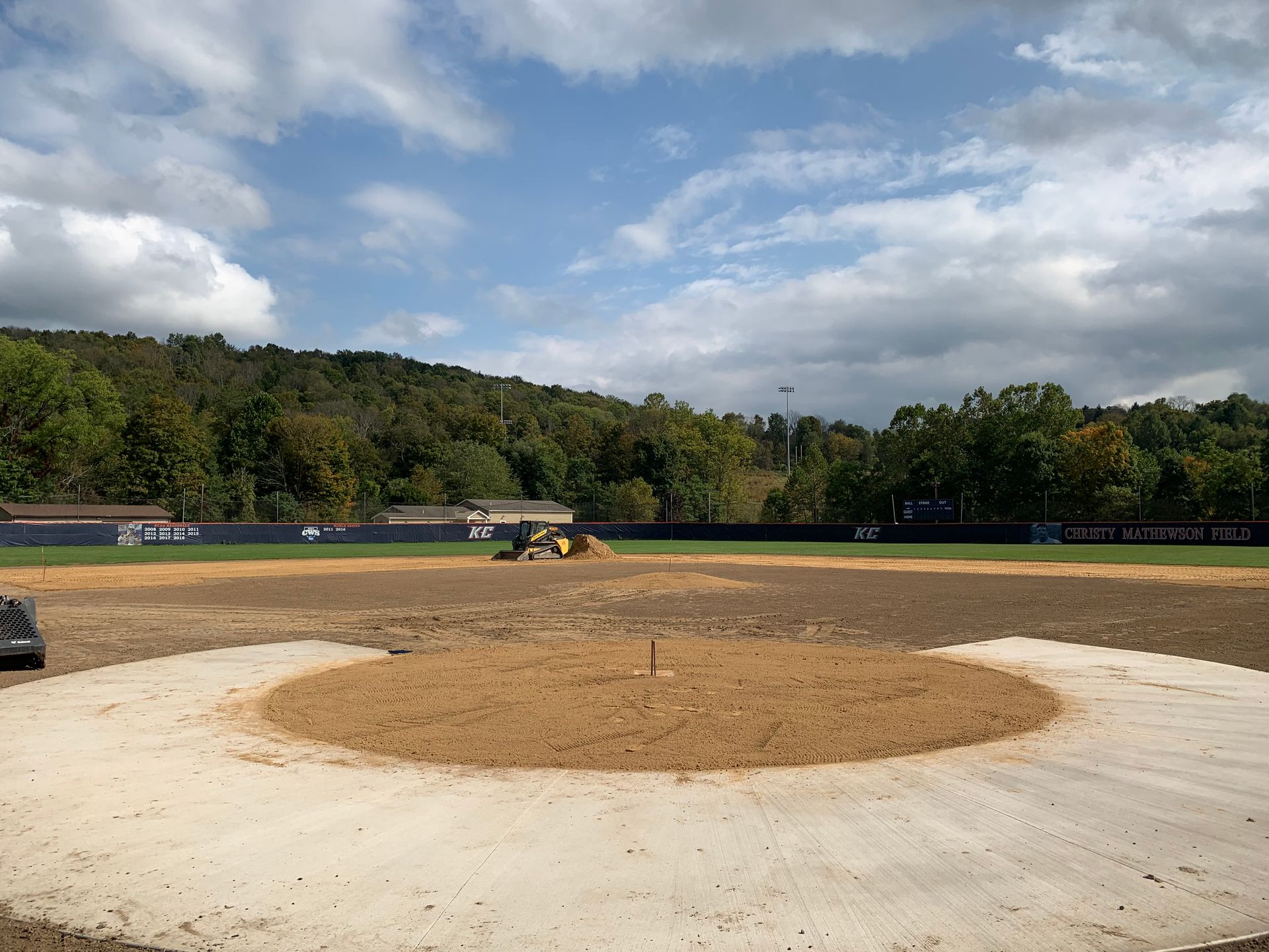 A baseball field with a circle in the middle of it