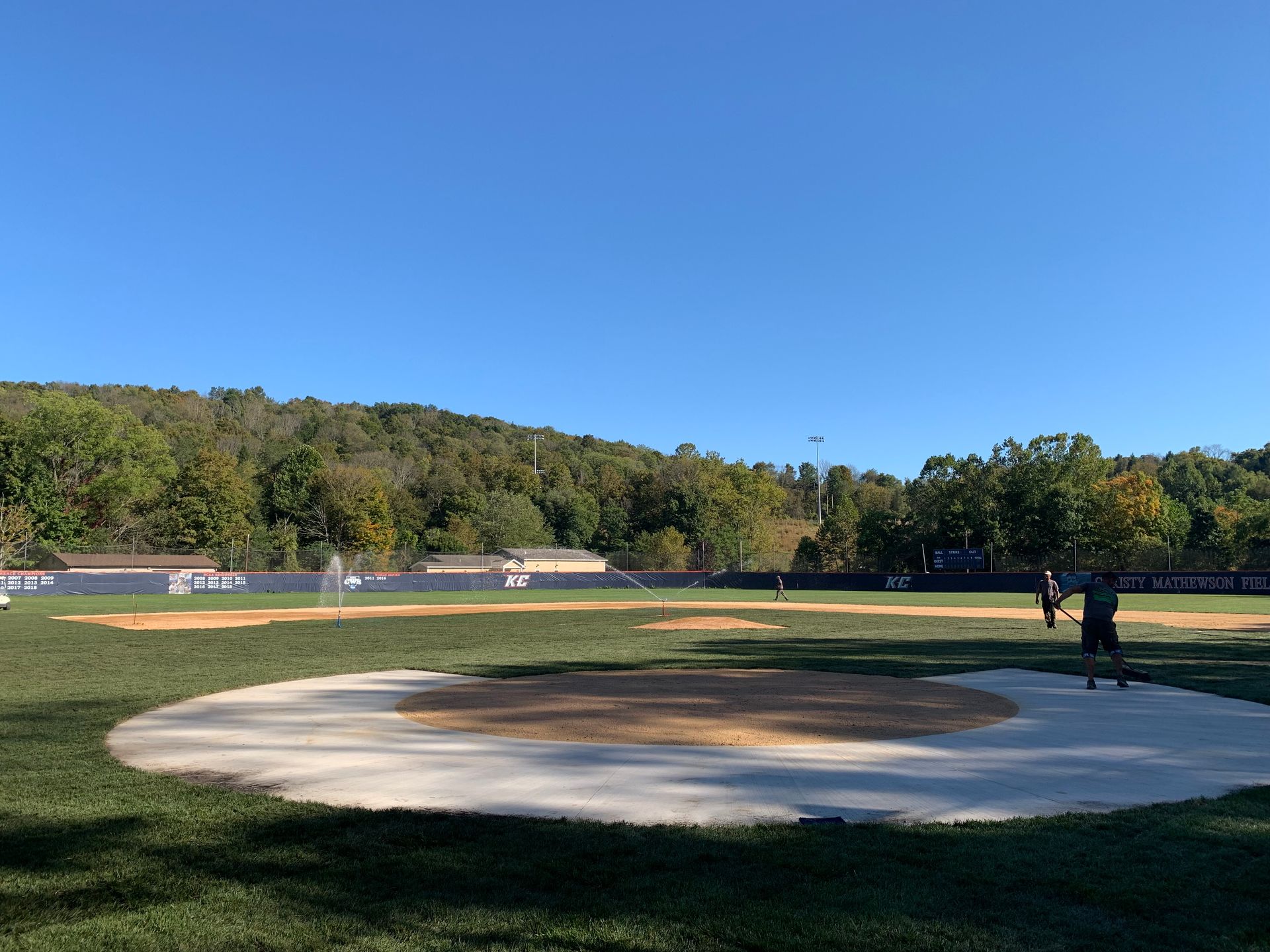 A baseball field with a circle in the middle of it