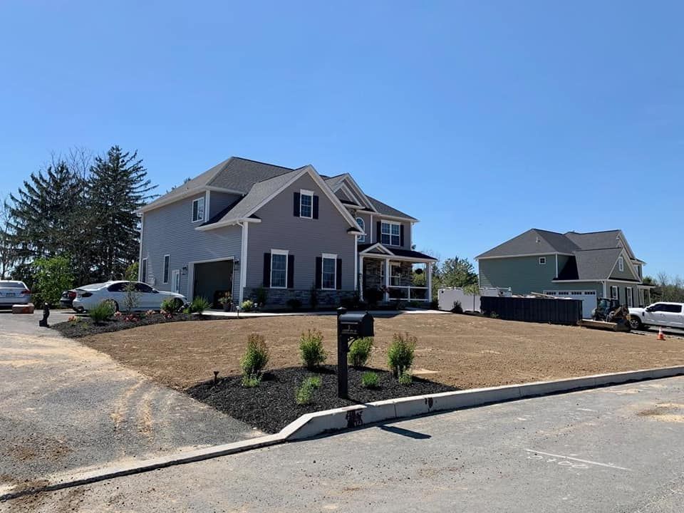 A large house with a mailbox in front of it