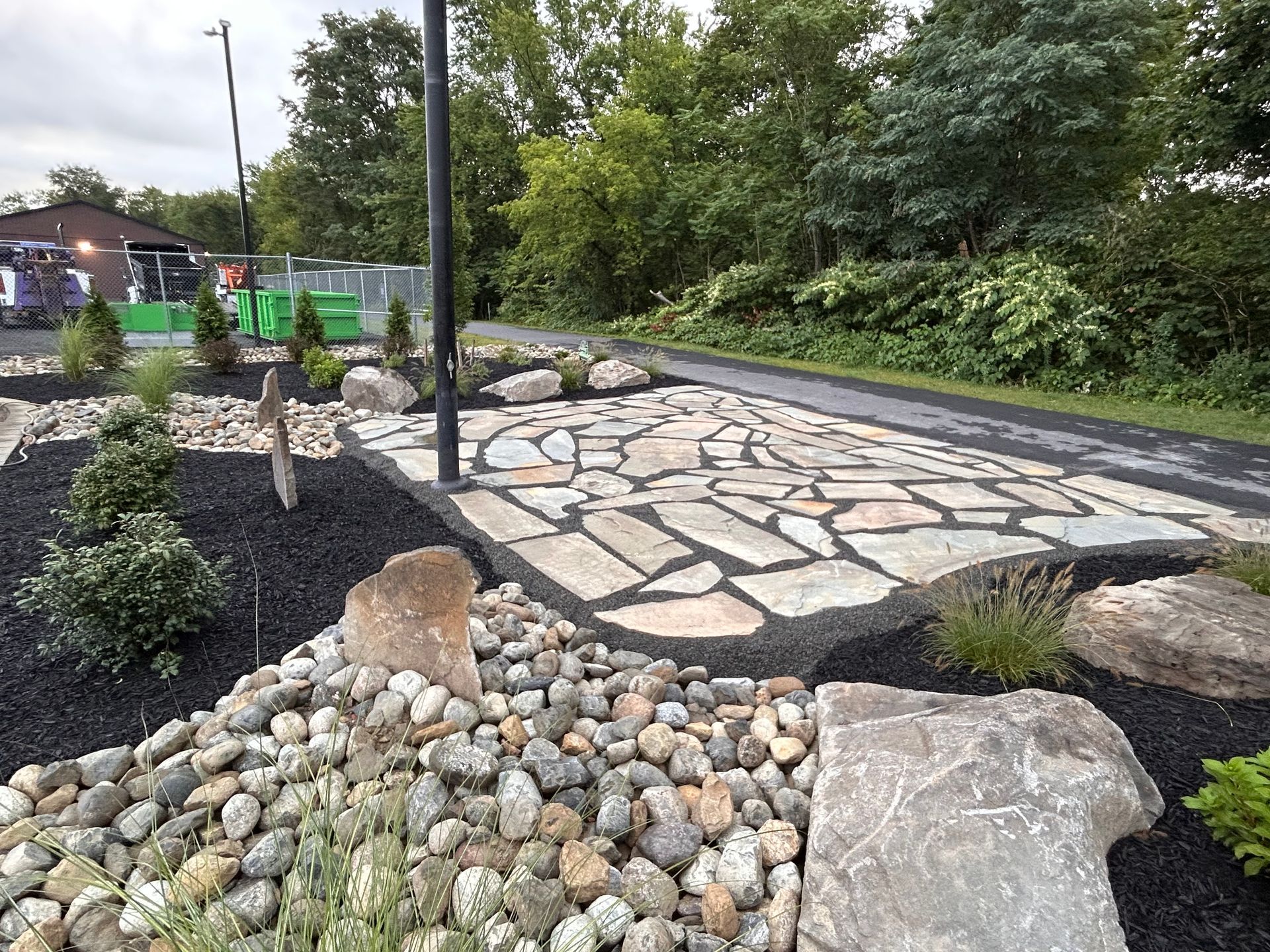 Mulch, field stone and river rock increase curb appeal and creates a more sustainable landscape for business owners.