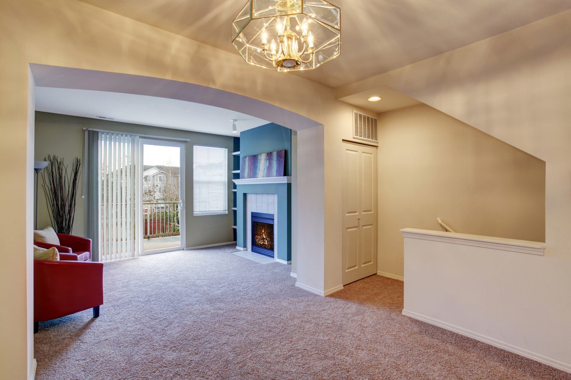 upstairs loft with carpet fireplace and sliding glass doors