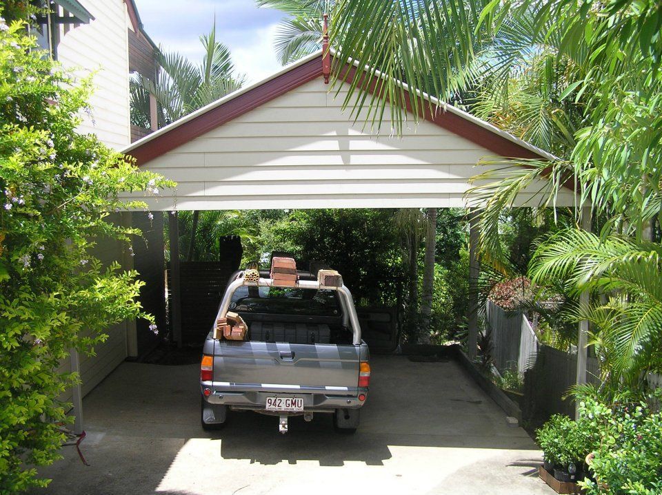 A Truck Is Parked Under A Carport — Austeel Sheds in Collinsville, QLD
