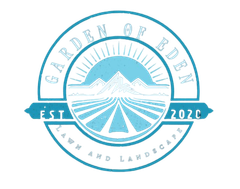 Logo for "Garden of Eden" lawn and landscape, blue and white, featuring mountains and fields with sunburst.
