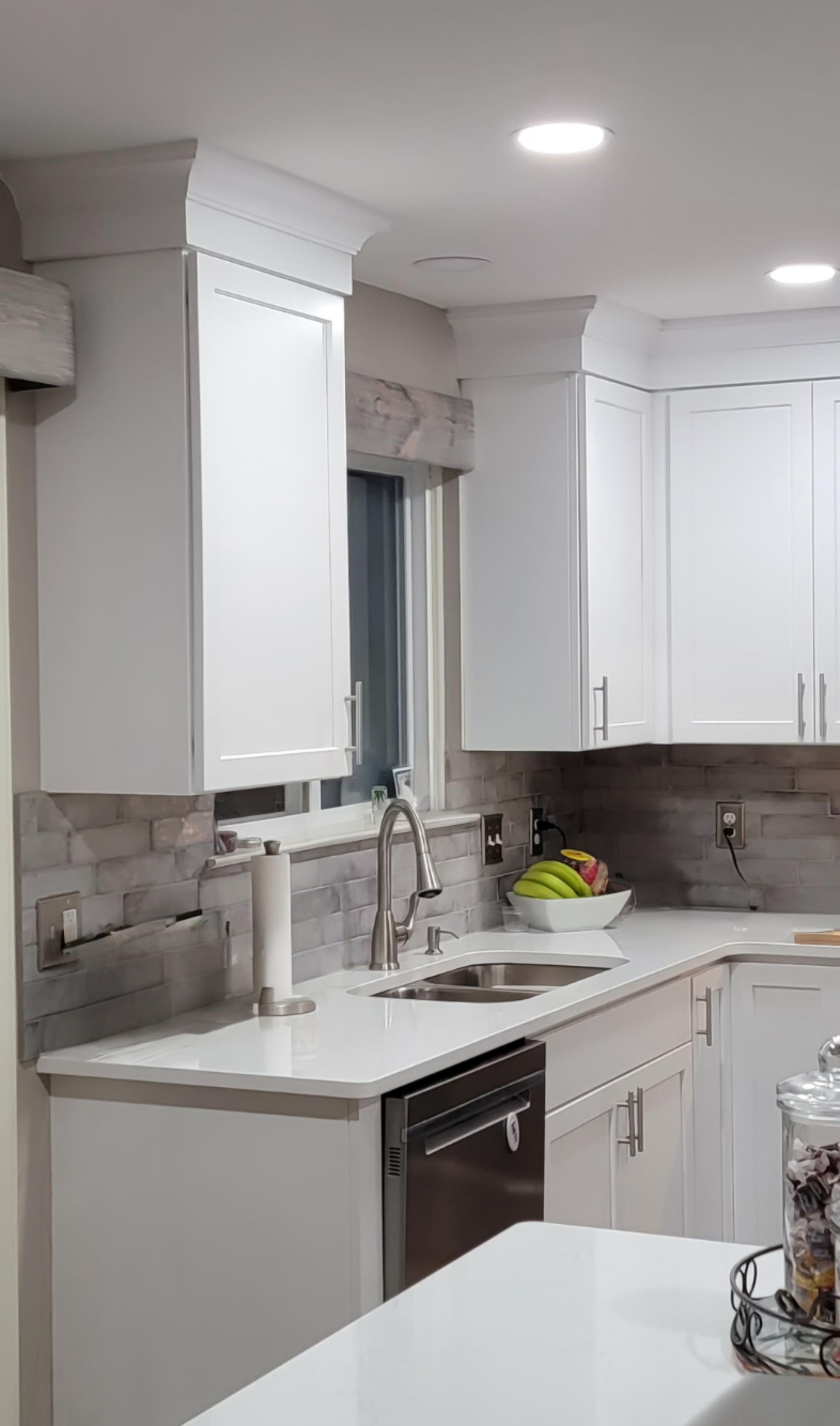 A kitchen with stainless steel appliances and a stove top oven.