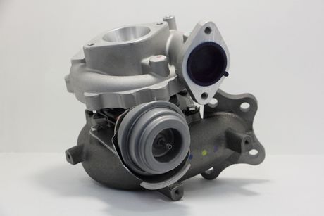 A close up of a turbocharger on a white surface