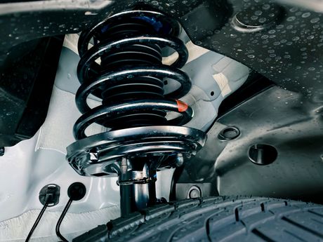 A close up of a shock absorber on a car