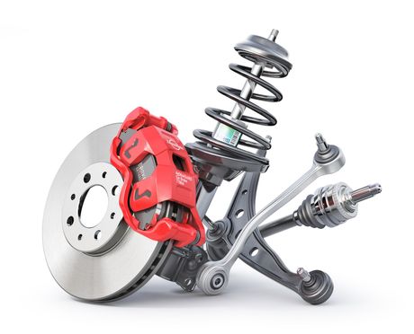 A brake disc , shock absorber , and other car parts on a white background.
