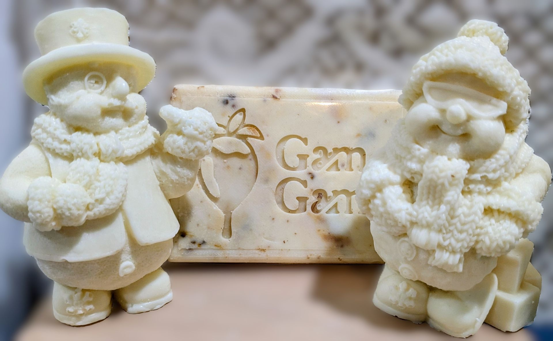 Two snowman white chocolate bars with the GamGams logo.