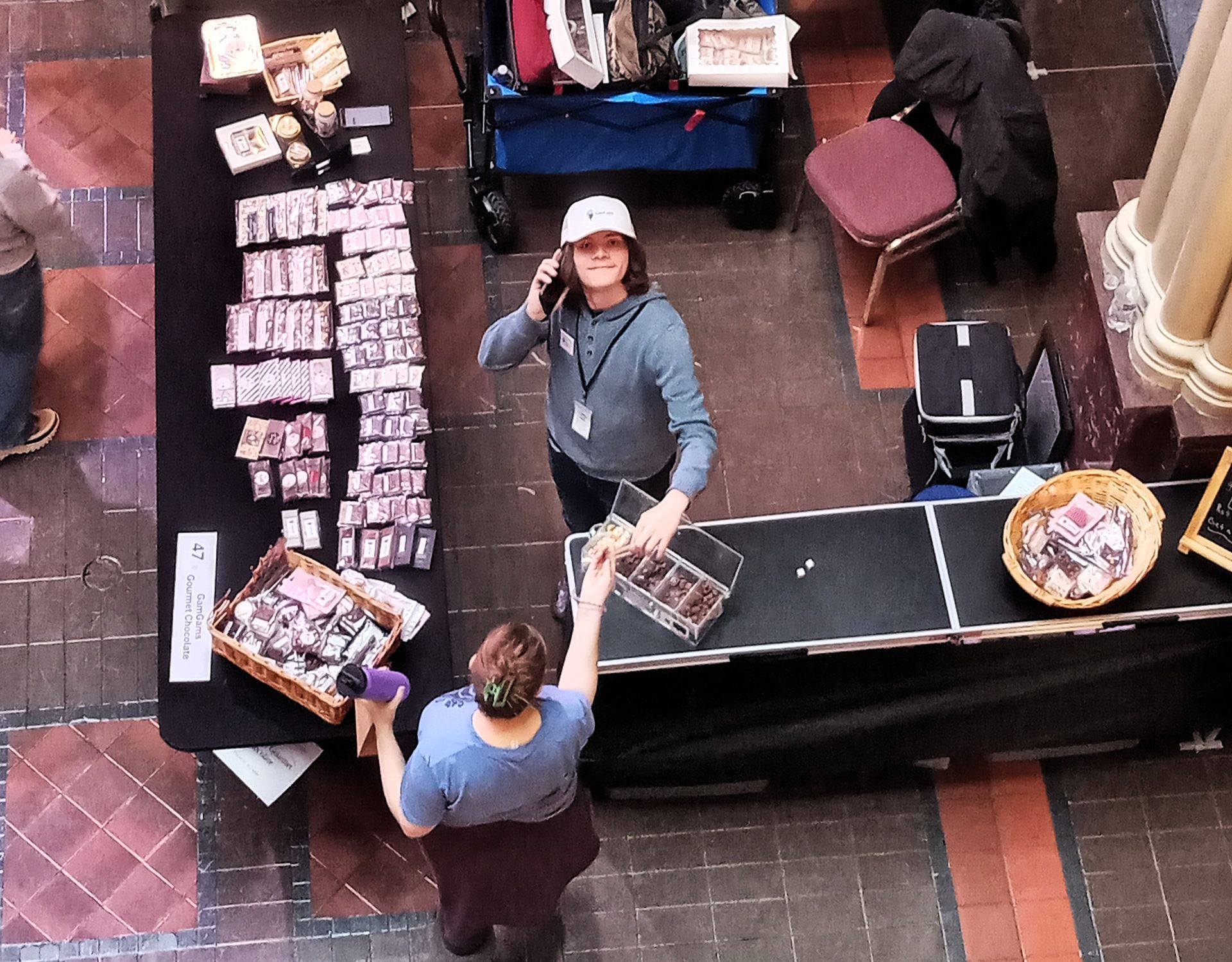 GamGams helper selling products at the Holiday Bazaar St. Paul, MN Landmark Center.