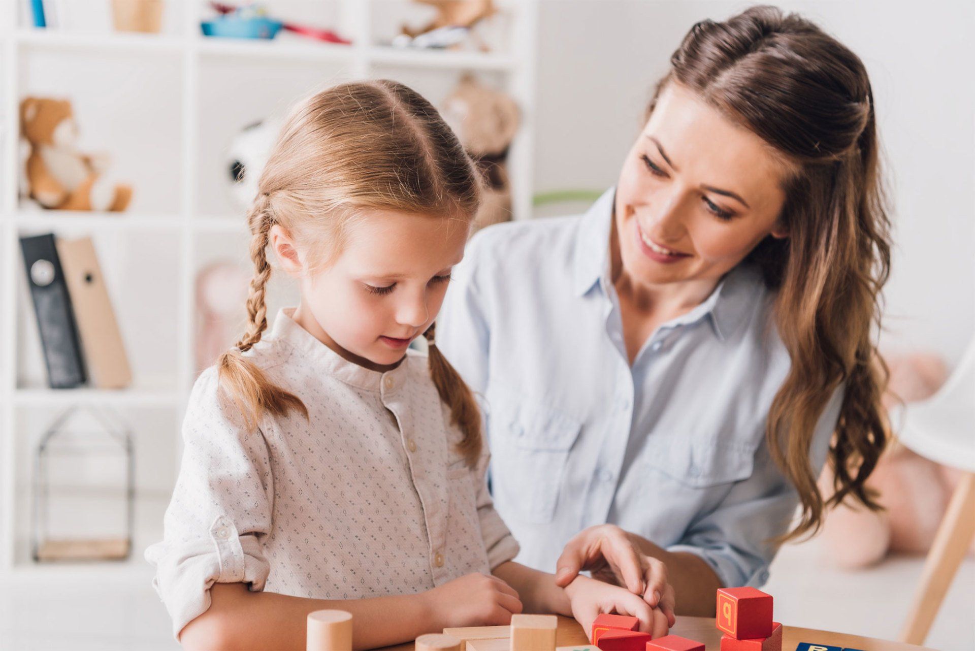 Woman and Little Child Playing Blocks — Tarrant County, TX — David F. Pickering - Attorney at Law
