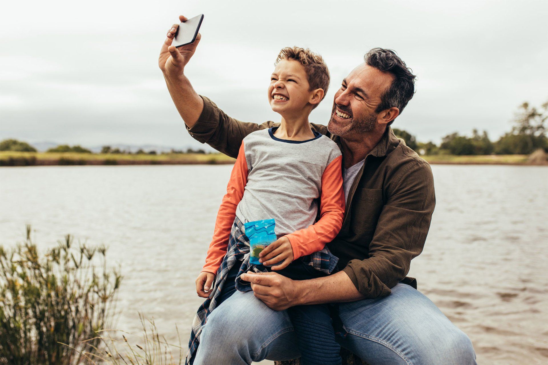 Father and Son Taking a Selfie on A Lake — Tarrant County, TX — David F. Pickering - Attorney at Law