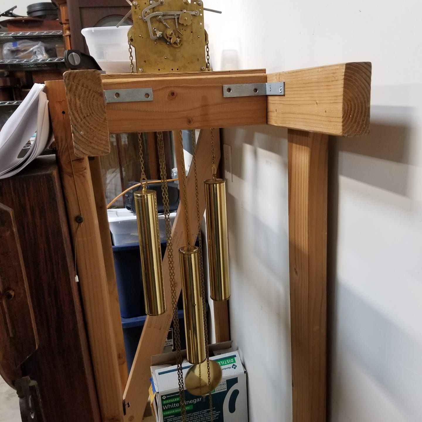 A wooden frame with a clock on top of it