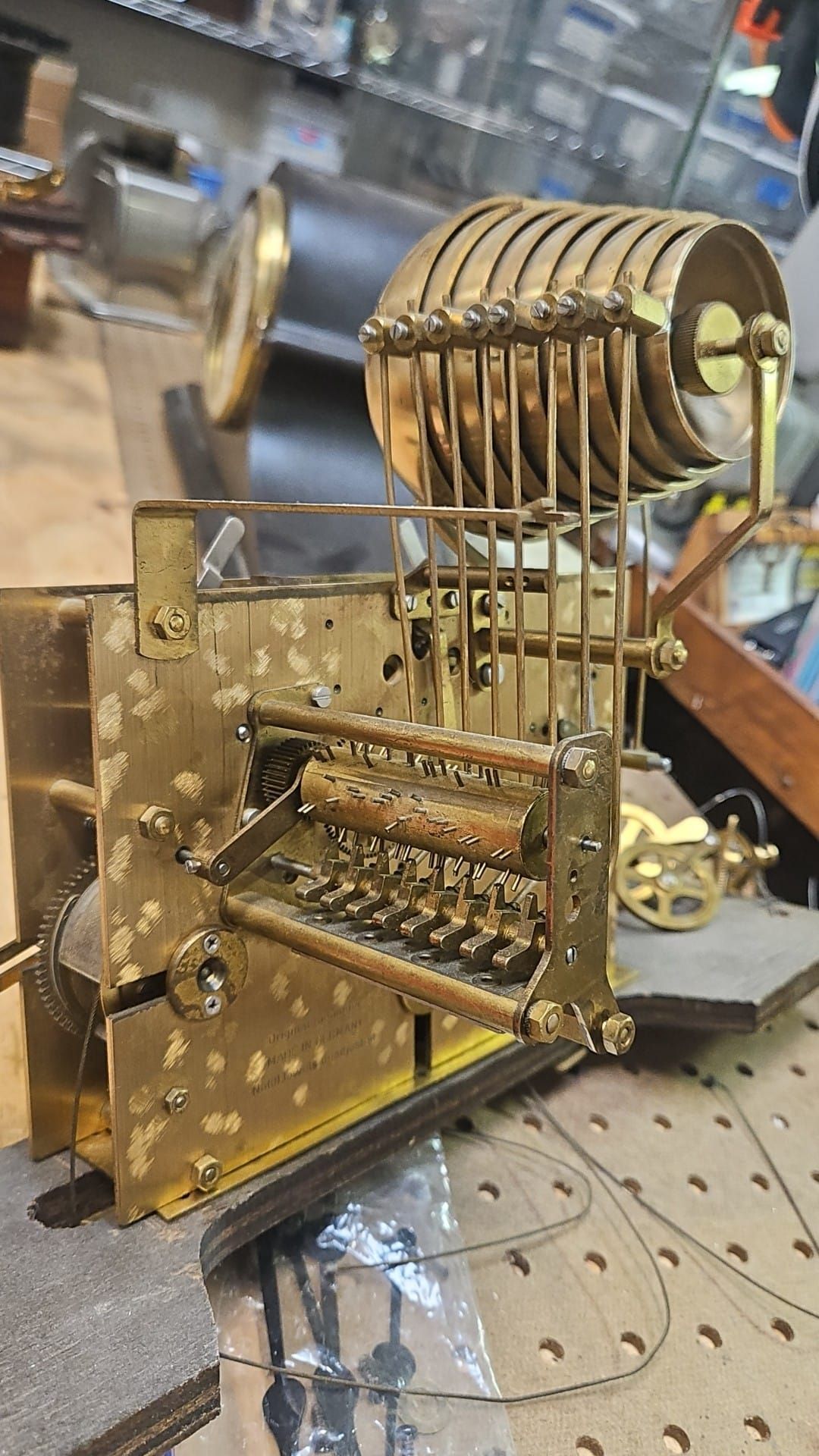 A close up of a clock mechanism on a table.