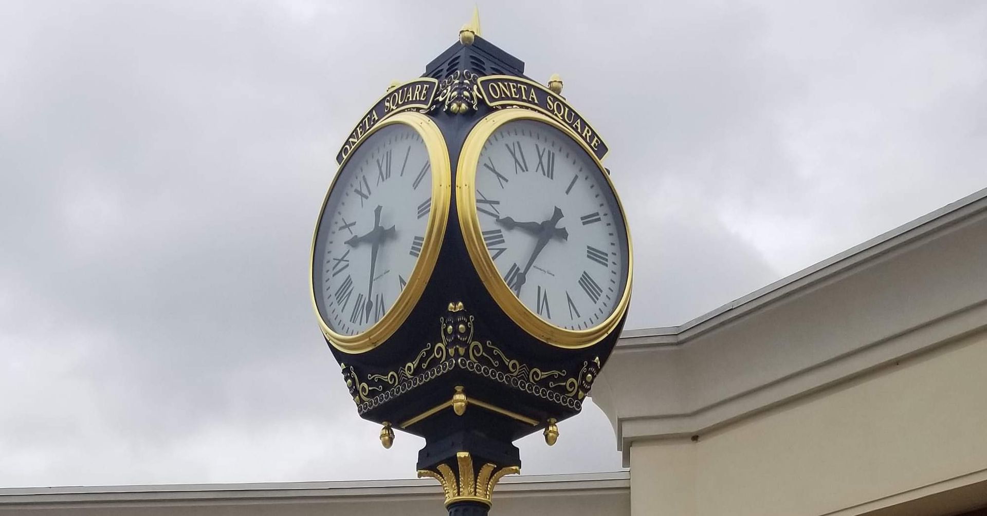 A clock on a pole that shows the time as 4:20