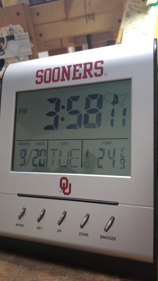 A sooners digital clock shows the time as 3:58