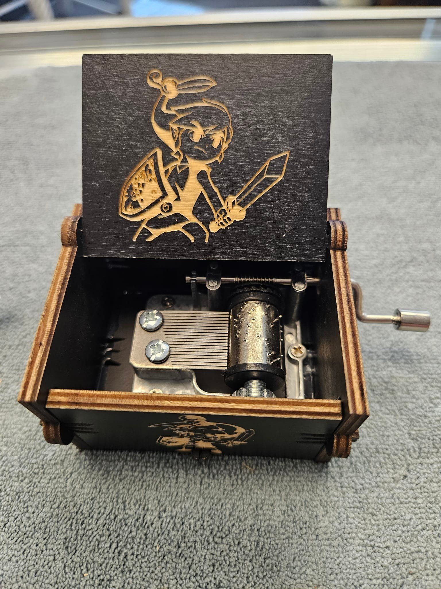 A music box with a picture of a knight on it