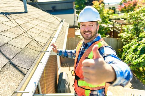 roofing contractor giving a thumbs up