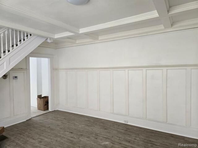 There is a staircase in the corner of the room.
